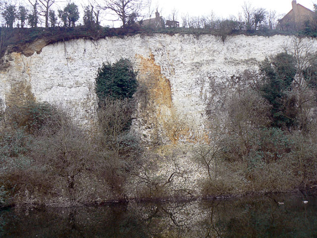 A chalk cliff face at Warren Gorge, rendered in a pop-art duotone screen.