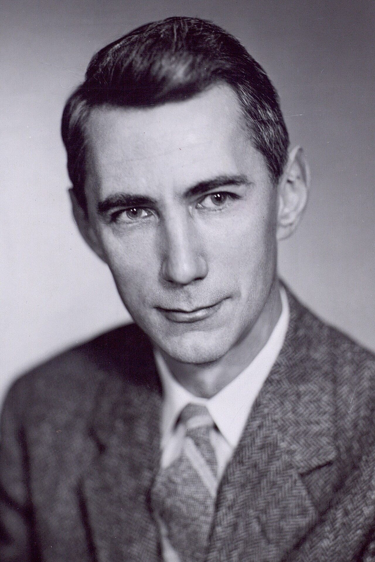 Black-and-white portrait of Claude Elwood Shannon, founder of information theory.