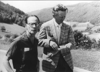 Black-and-white photograph of mathematicians André Weil and Atle Selberg standing outdoors on a hillside terrace at Oberwolfach in 1968.