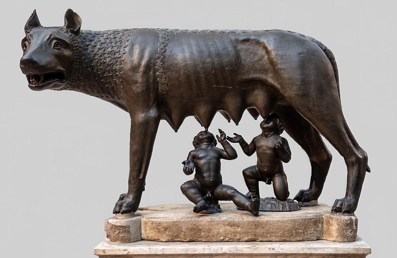 Lupa Capitolina: a bronze she-wolf standing over the twin infants Romulus and Remus who reach up to suckle.