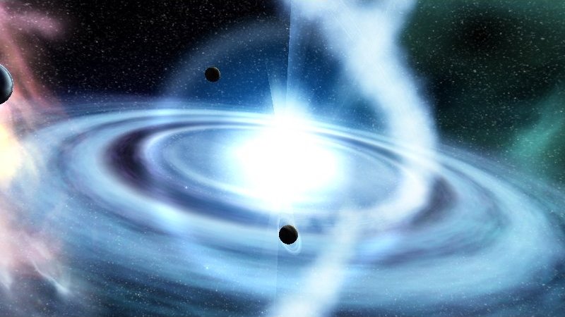 A glowing blue accretion-disc galaxy with orbiting dark spheres, rendered in real time — a frame from a 64k intro.