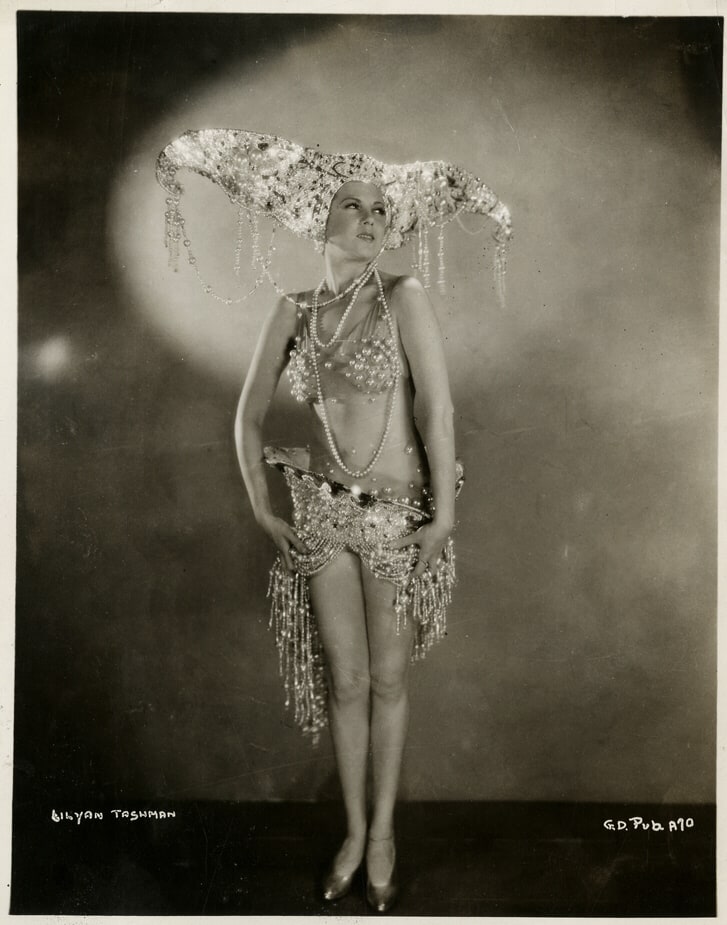 Actress Lilyan Tashman in a still from the 1929 film Gold Diggers of Broadway, rendered here in high-contrast purple duotone.