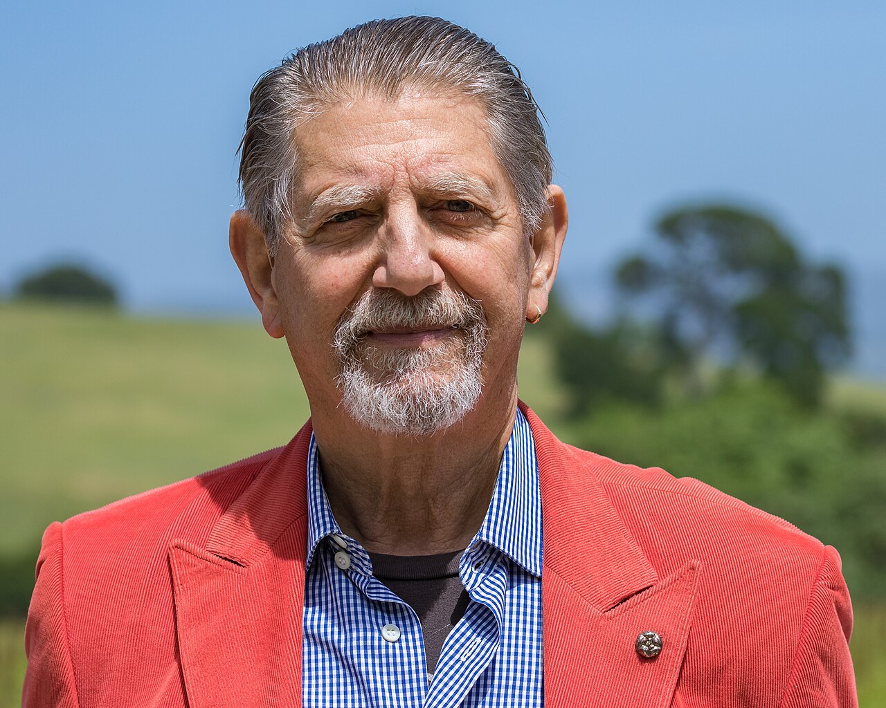 Peter Coyote, a founding Digger, photographed at Durell Vineyard in Sonoma in 2019, rendered in high-contrast purple duotone.