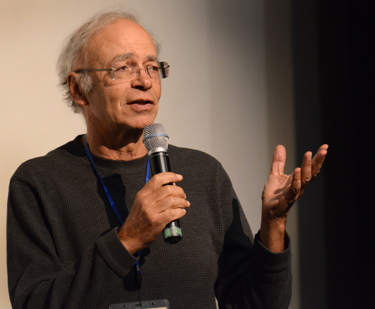 Peter Singer speaking on stage at an Effective Altruism conference in Melbourne, 2015.
