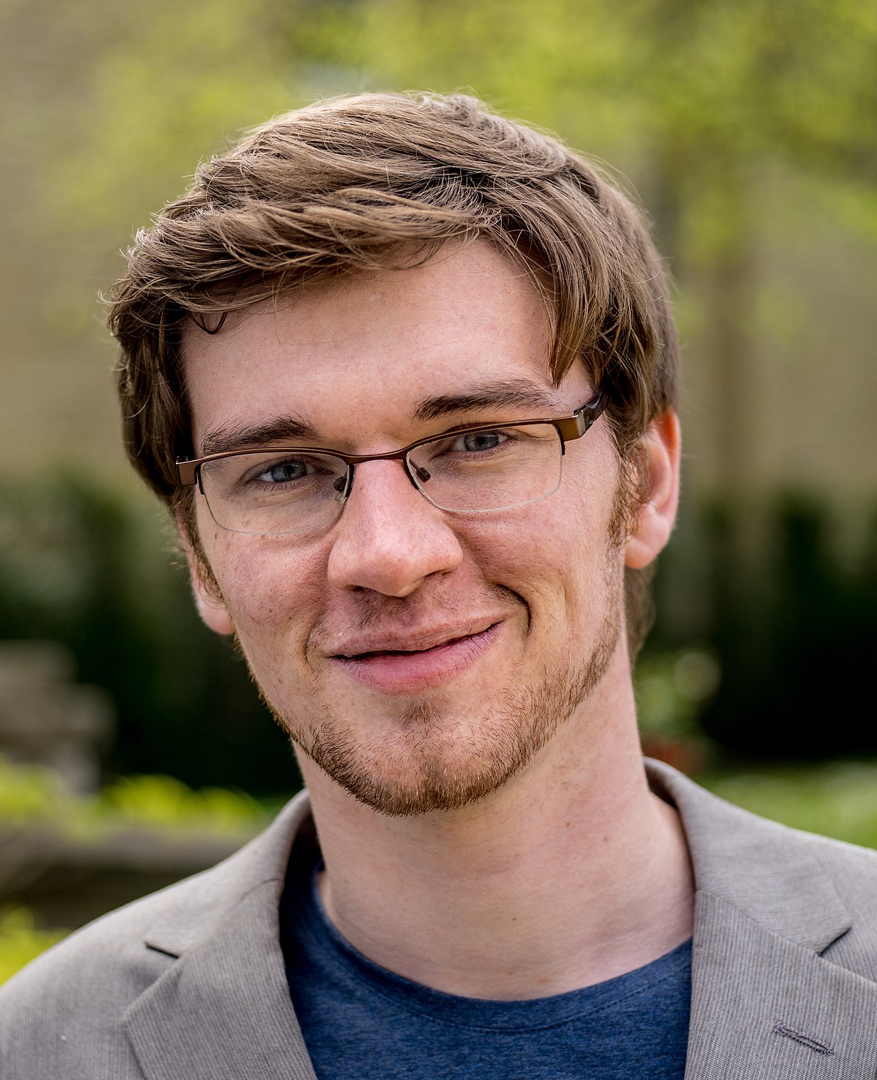 Portrait photograph of the philosopher William MacAskill, taken in Oxford in 2015.