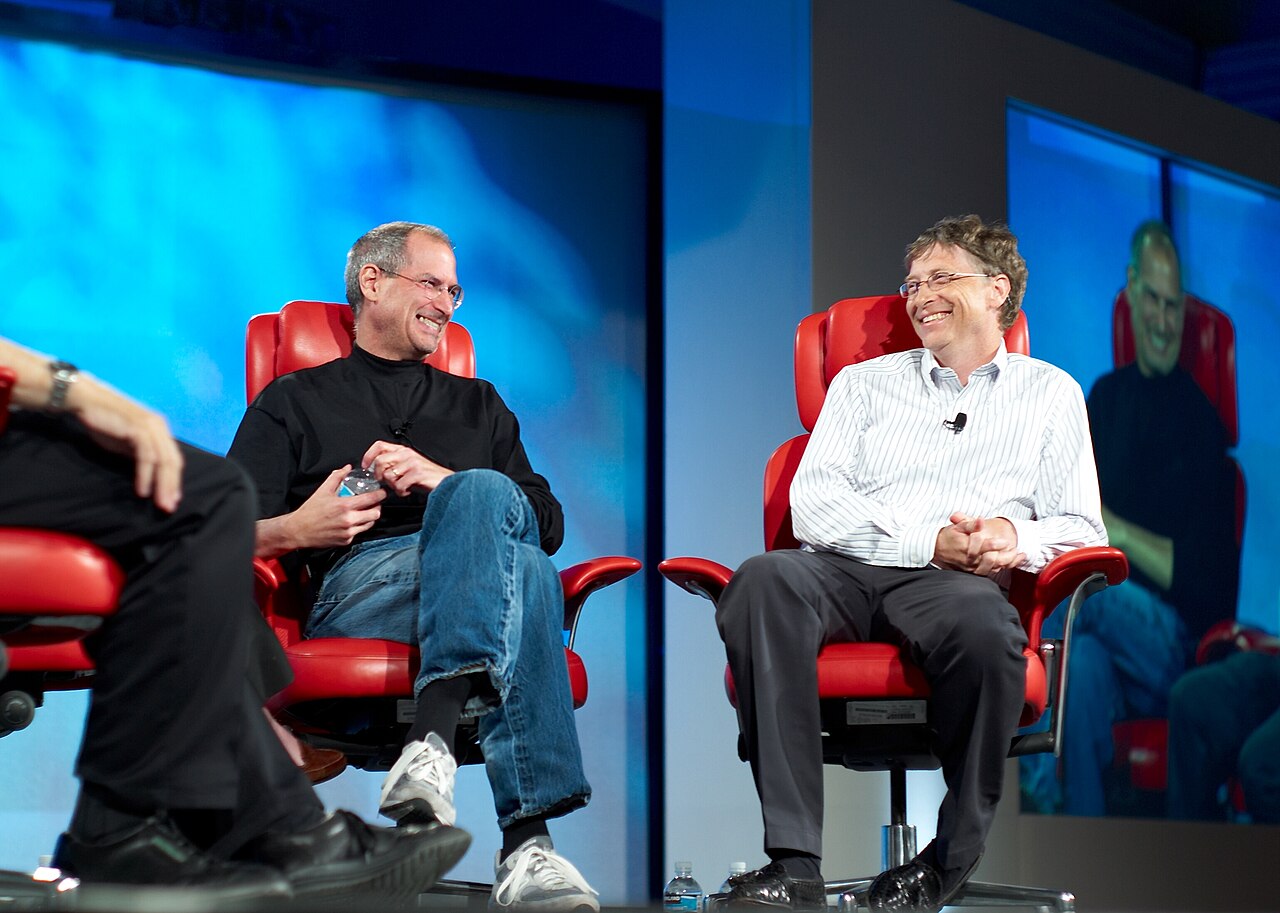 Steve Jobs and Bill Gates seated together on stage at a 2007 conference.