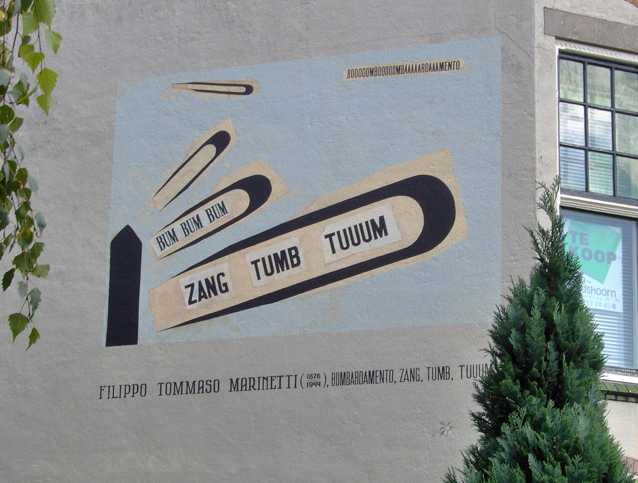 A wall painting in Leiden reproducing Marinetti's sound-poem Zang Tumb Tuuum: black wood-type words BUM BUM BUM, ZANG, TUMB, TUUUM erupting diagonally across pale blue.