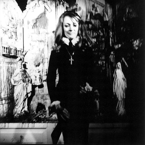 Portrait of the artist Niki de Saint Phalle looking toward the camera.