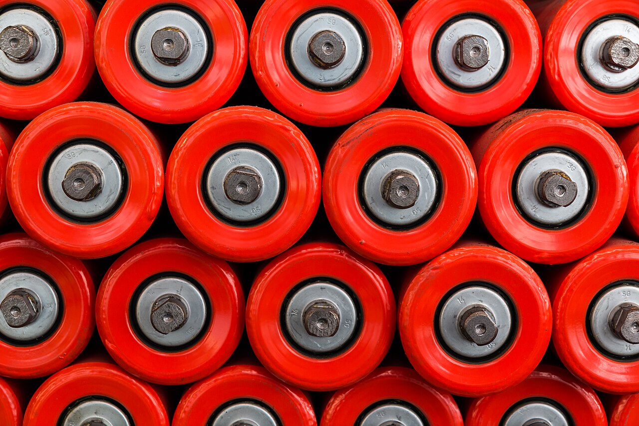 Rows of machined bearings laid out on shelves in a tool shed — parts of a workshop.