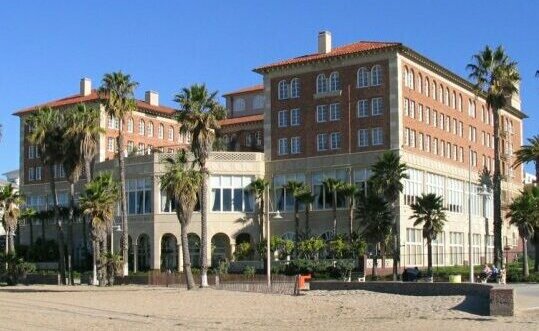 Detail view of the Casa del Mar building at Santa Monica beach, its arched stone façade cropped closer.