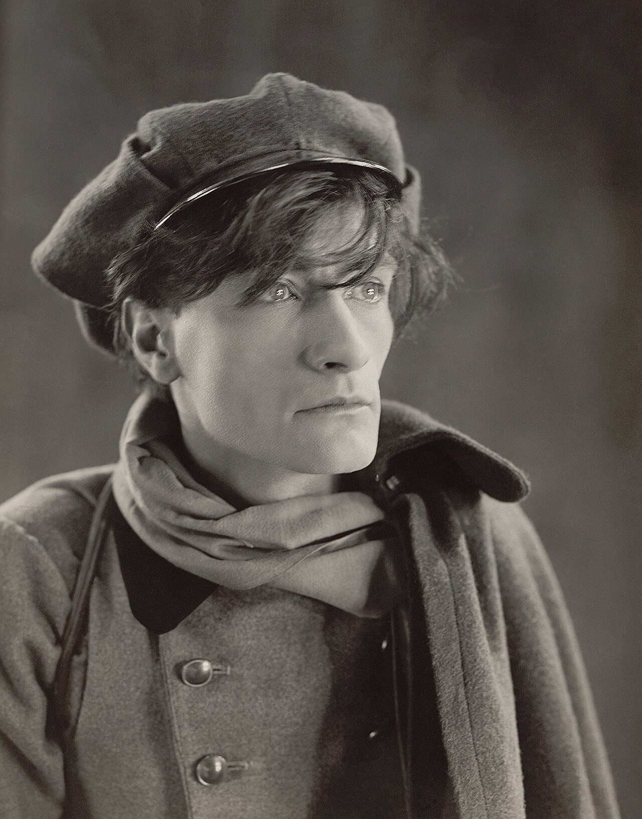 Restored portrait photograph of Antonin Artaud, 1926, gazing intently toward the camera in high contrast.
