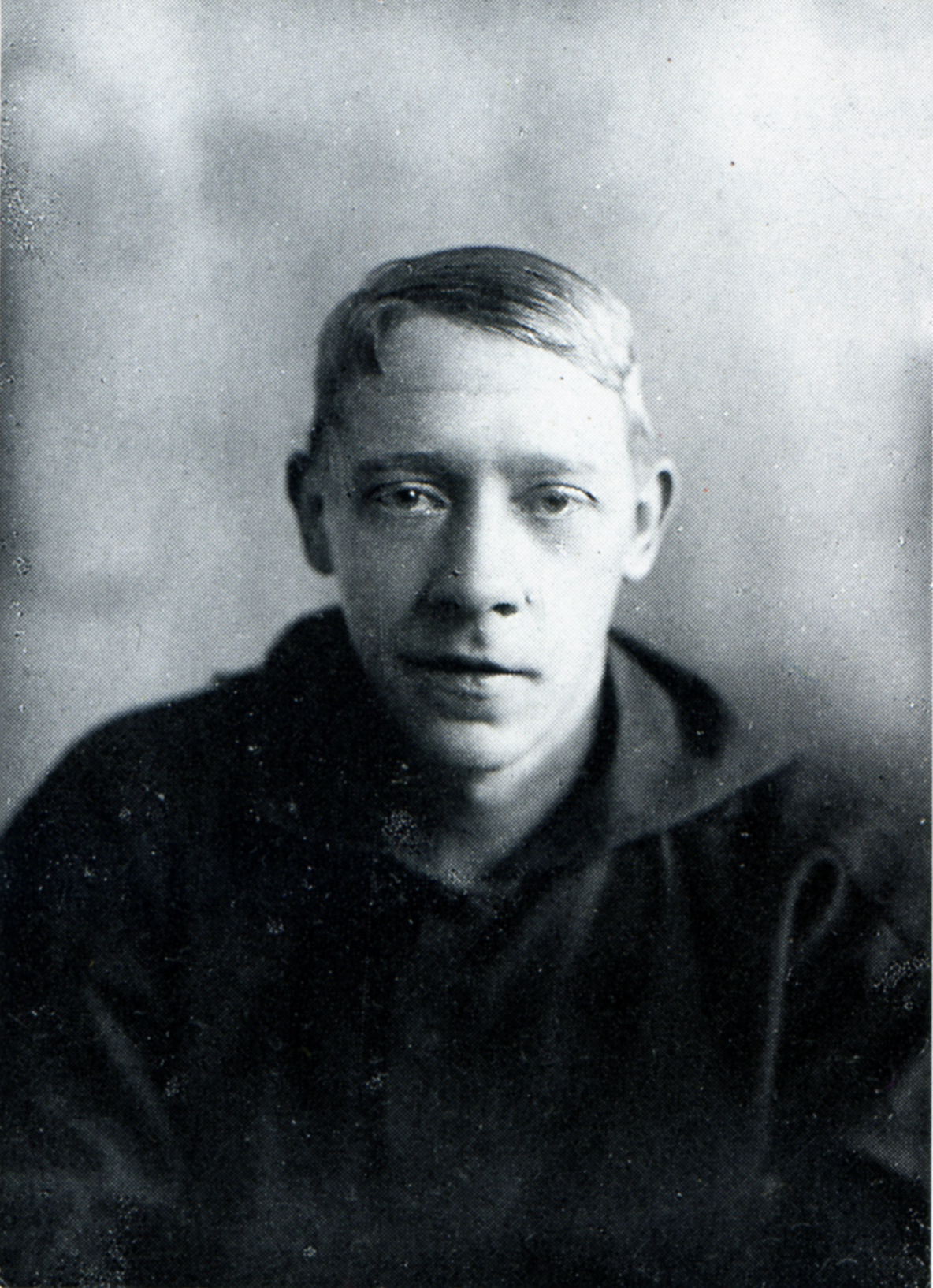 Black-and-white photographic portrait of Vladimir Tatlin dressed as a sailor, gazing directly at the camera